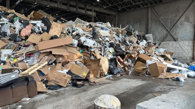 Large pile of mixed waste materials