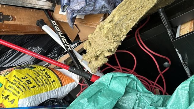 Cluttered garage filled with junk.