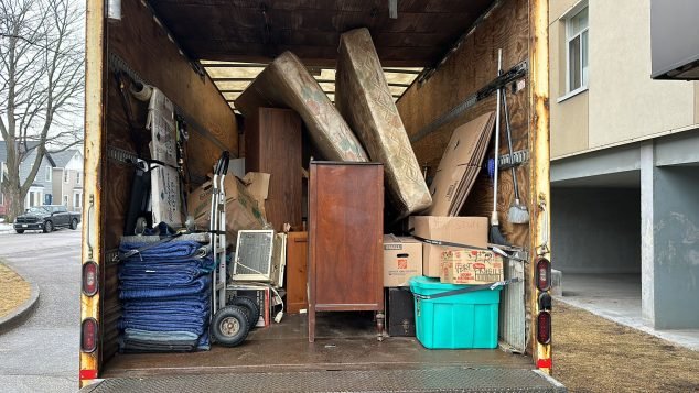 Packed moving truck with various items
