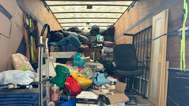 Cluttered storage truck filled with items