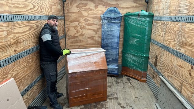 Furniture being loaded into a truck.