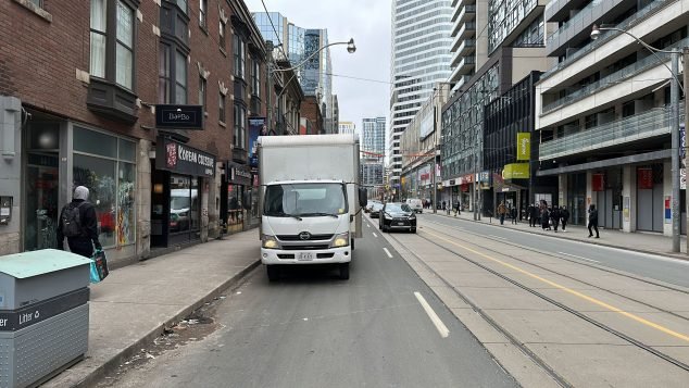 Urban street with parked delivery truck