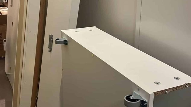 Stacked white furniture panels and components