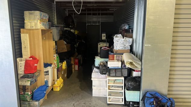 Cluttered storage unit filled with boxes