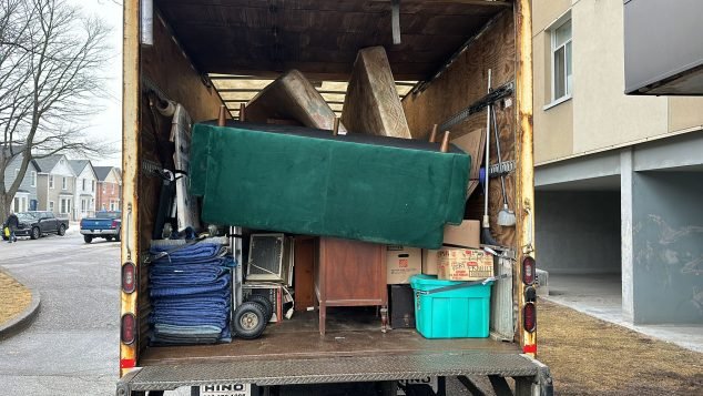 Filled moving truck with various items