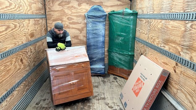 Moving furniture in a truck.