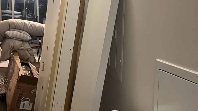 Stacked furniture parts against wall