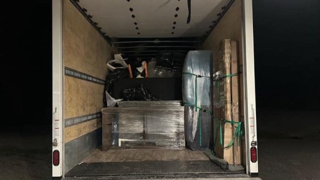 Truck loaded with furniture and boxes