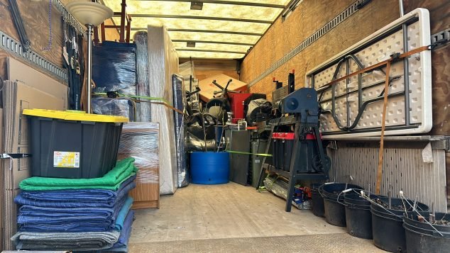 Packed moving truck with various items