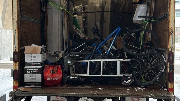 Cluttered moving truck filled with items.