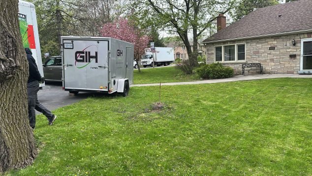 Trailer parked in residential yard.