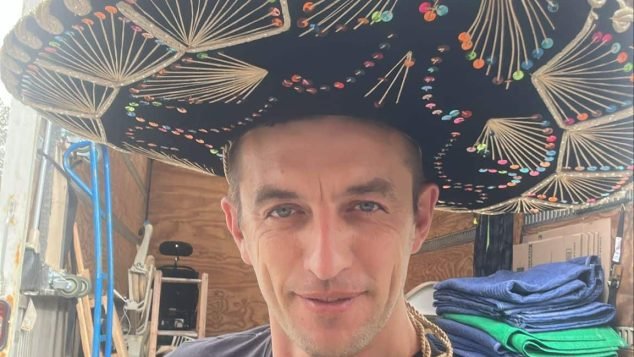 Person wearing a large sombrero hat.