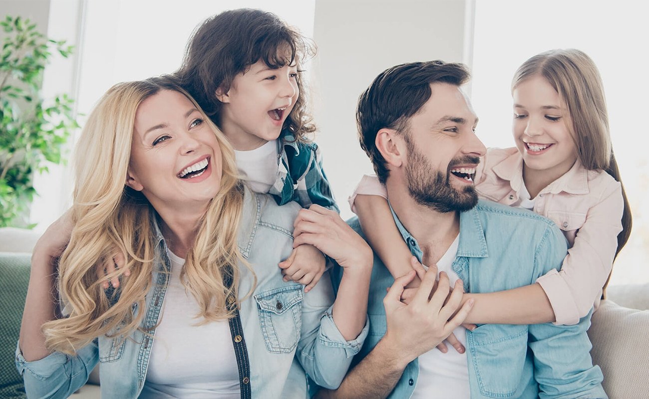Family-final Happy family posing together indoors.