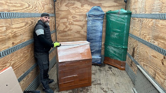 Professional same day movers loading furniture in Toronto